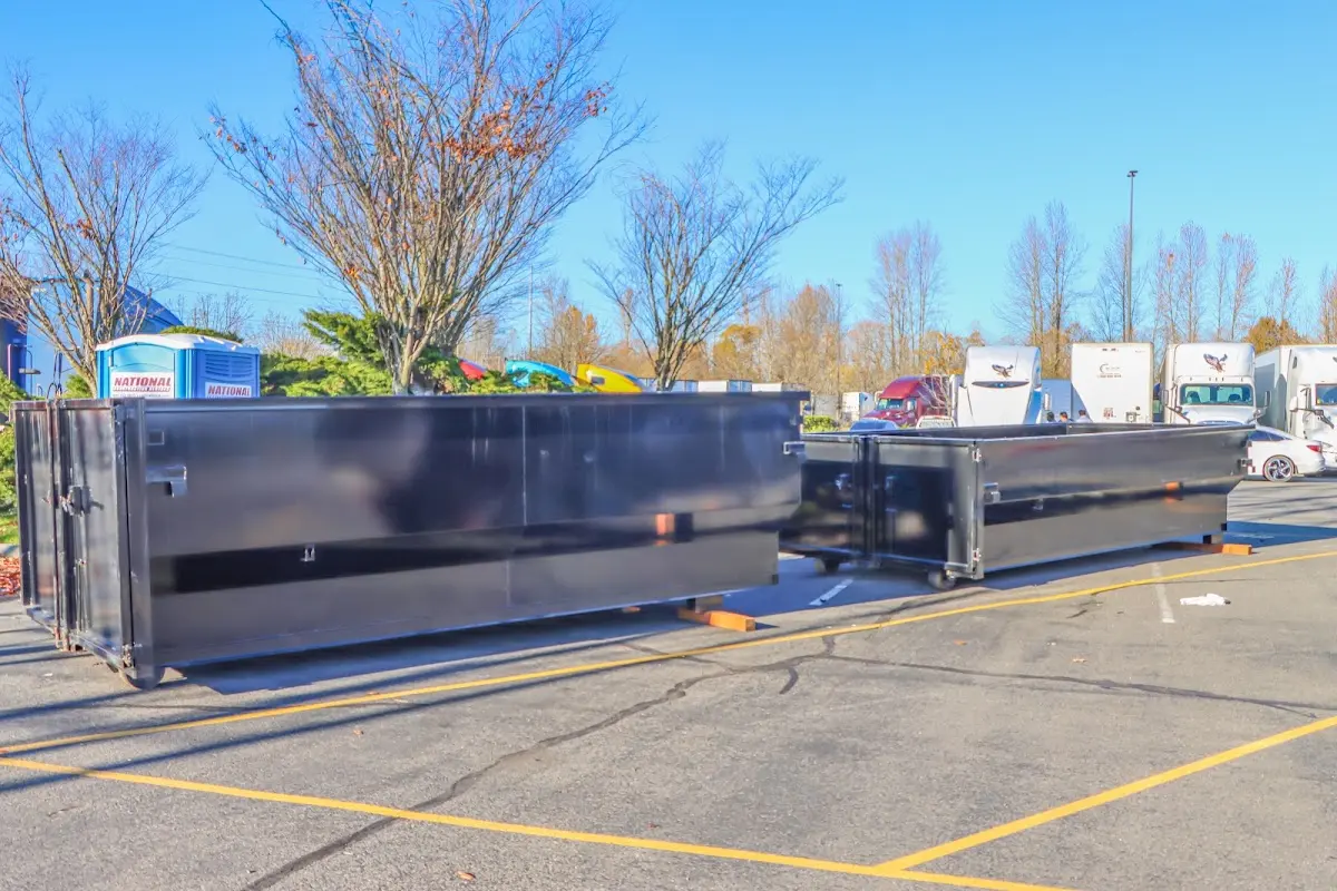 Professional dumpster rental service with roll-off container on residential driveway in North Sewickley